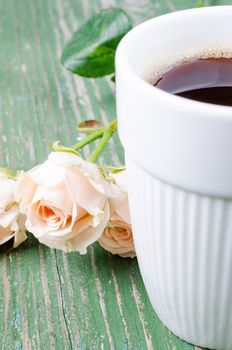 Сup of coffee in an old wooden table