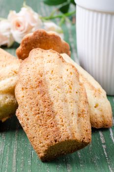 Madeleines on old wooden table