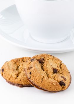 Two cookies on cup background