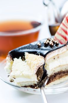 Chocolate cake slice on a background  tea