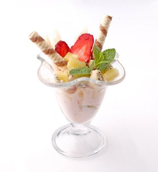 Ice cream cocktail with fruits and berries