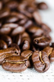 Coffee beans in a linen napkin close up