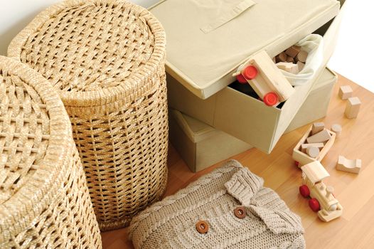 wicker containers for home, on wooden floor, top view