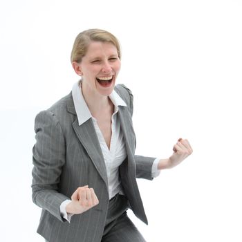 Ecstatic woman laughing and punching the air with her fists on receiving good news of her success