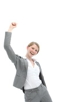 Motivated enthusiastic woman in stylish grey slacksuit punching the air confidently with her fist