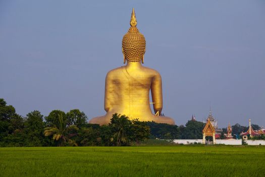 Big Buddha behind statue in thailand.