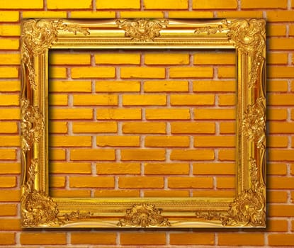 Gold frame on brickwall