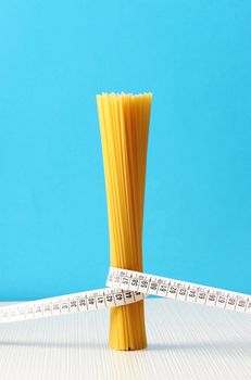 diet concept, Spaghetti with measuring tape 