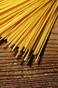 uncooked spaghetti noodles . Italian pasta