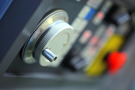 button in an  machine control panel , close up