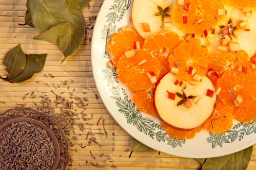 Fresh ripe dessert of oranges and apples
