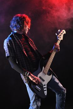 a bassist plays at a live concert