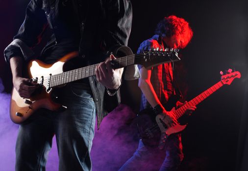 rock musicians playing at a live concert