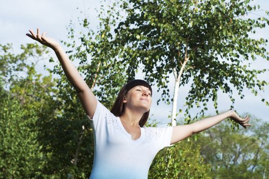 happiest woman in the park, opened her arms, glad and happy