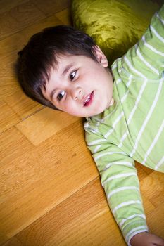 Baby is playing with educational abacus over wooden background