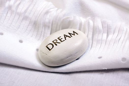 white dream stone on a white blanket 