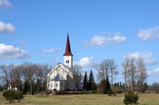 Estonia. Beautiful operating church on a background of the sky and clouds