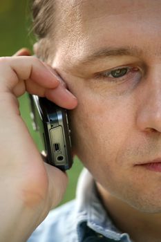 Portrait of the man with the phone close-up