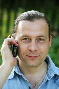 Portrait of the man with the phone close-up