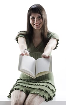 young Woman holding an open book . Pages are blank