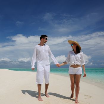 Couple on a tropical beach at Maldives