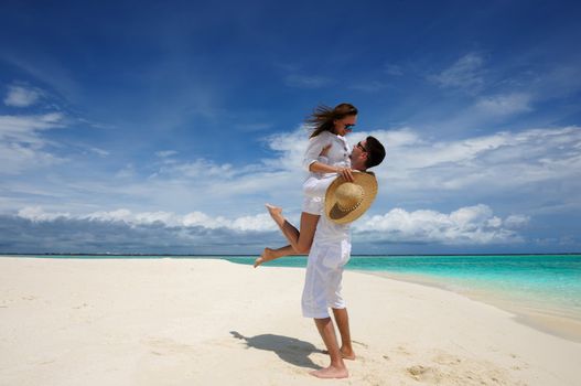 Couple on a tropical beach at Maldives