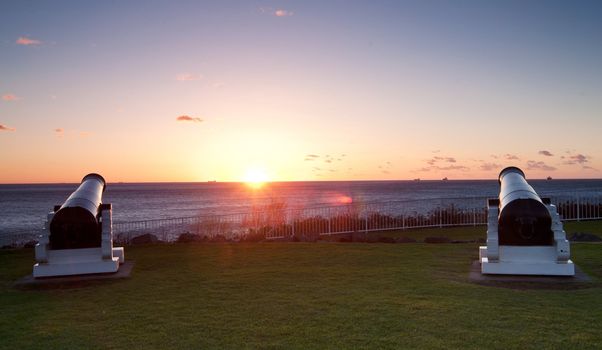 sunrise over the ocean and cannons at wollongong