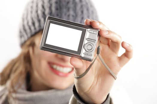 woman with a camera taking a photo of herself - display is white