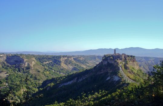 The Italian hill town of Civita di Bagnoregio rests quietly on a hilltop created by earthquake and erosion.