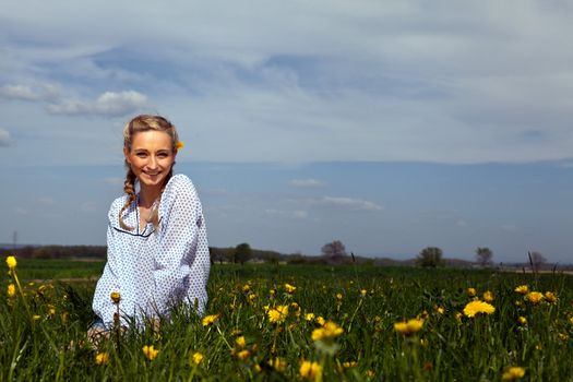 smiling woman outdoor in summer with flowers
