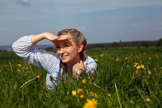 smiling woman outdoor in summer with flowers