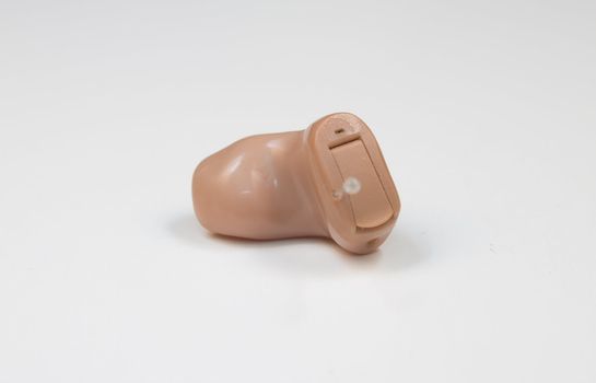 A single in-the-canal (ITC) hearing aid device to assist with hearing loss.