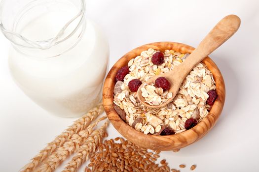 Cereal muesli breakfast with dried fruit and milk