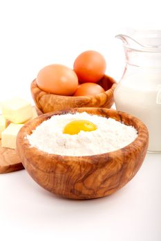 Milk, flour and eggs, ingredients for baking. isolated on a white background