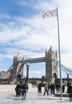 LONDON, UK - APRIL 30: Olympic flag with Tower Bridge in the background. April 30, 2012 in London. London will host the 2012 Olympic Games.