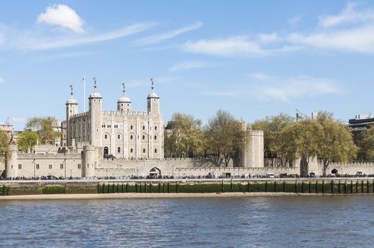 LONDON, UK - APRIL 30: The Tower of London seen from the Thames south bank. April 30, 2012 in London. The fortress dates back from the 1070s.