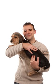 Portrait of a man holding a cute mixed breed dog isolated over white.