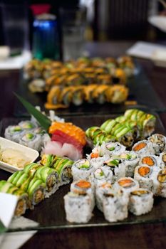 Variety of authentic sushi rolls on a platter. 