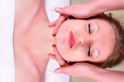 Female receiving a head massage in a SPA