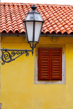 old street-lamp on house window