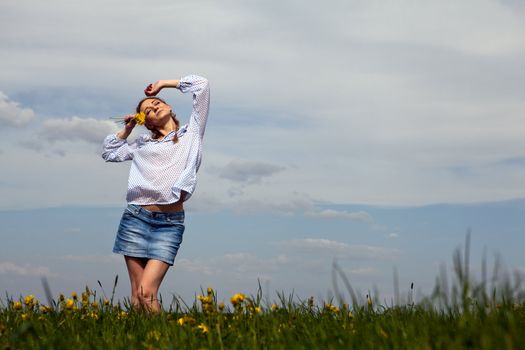 young woman is happy outdoor in summer