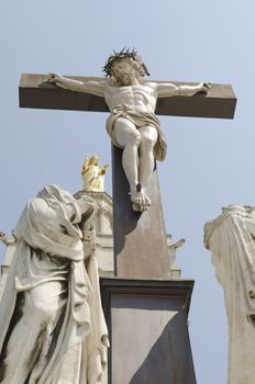 jesus cross with statues, symbol of faith