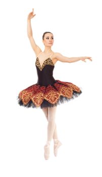 Beautiful ballerina dancing in tiptoe position on white background