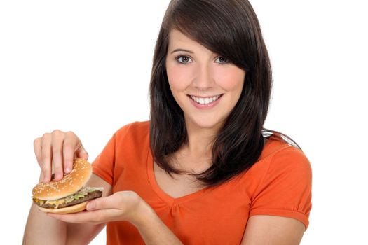 girl looking at a hamburger