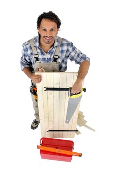 high angle shot of cabinetmaker making shutter