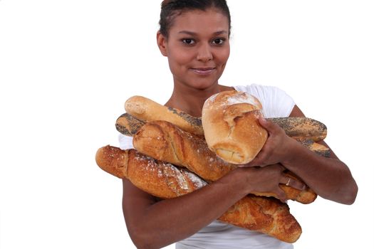 young black woman holding a lot of bread in her arms