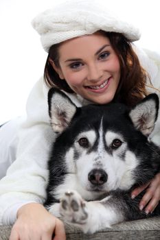 Portrait of a woman with her husky dog