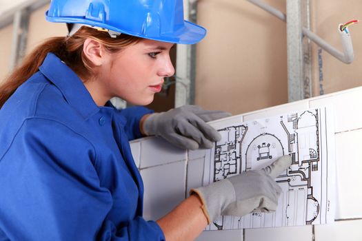 Woman with electrical diagram