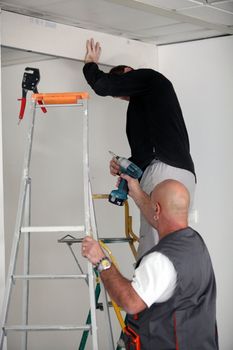 Two electricians working together