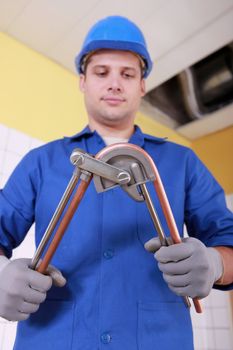 Plumber preparing copper pipe